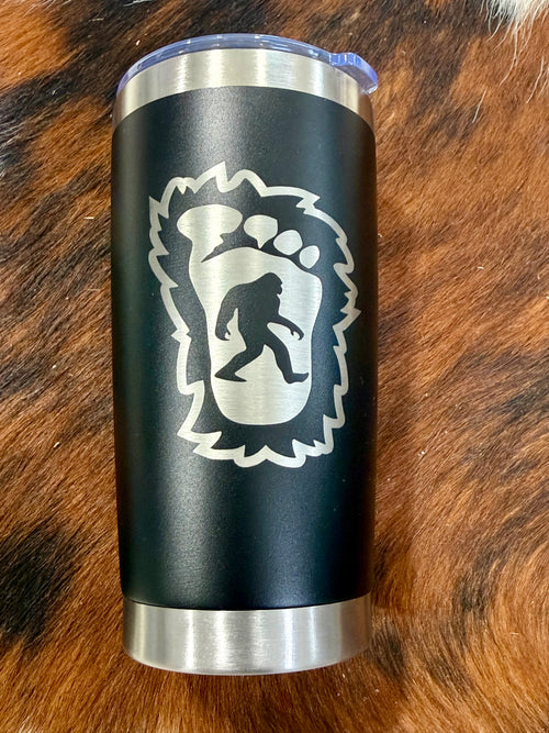 Black 20 oz tumbler with silver-tone Bigfoot footprint design and clear lid